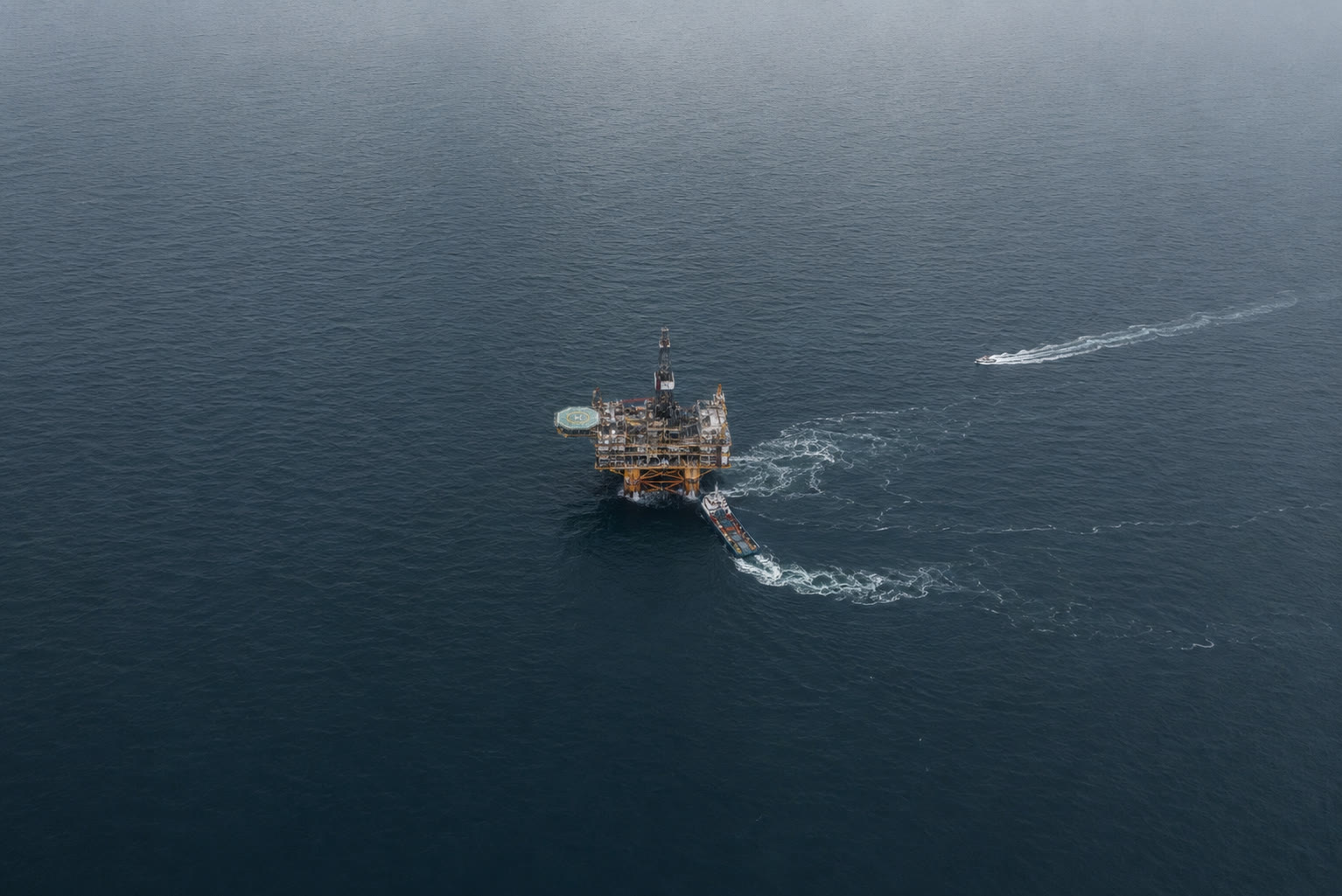 An offshore production platform seen from above at dusk