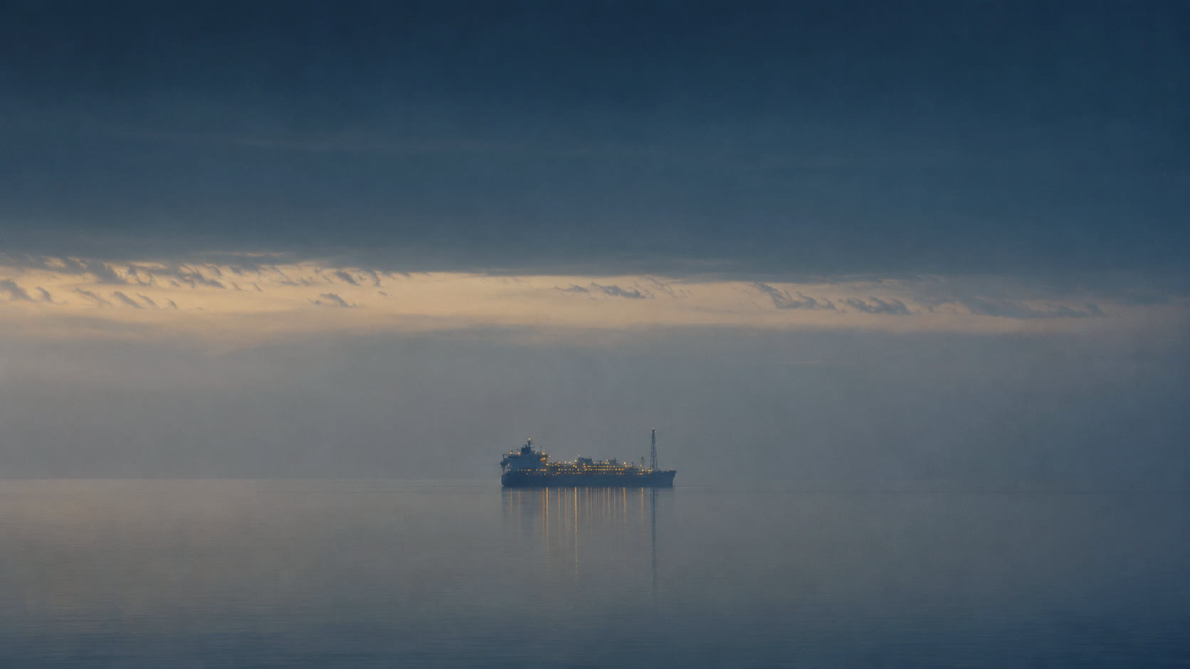 An FPSO and offshore field at dusk